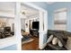 Open-concept living room showcasing hardwood floors and an easy flow into the dining area at 2401 N Olney St, Indianapolis, IN 46218