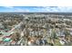 This elevated view captures a residential neighborhood with houses, streets, and sparse trees and commercial buildings in the background at 2402 Adams St, Indianapolis, IN 46218