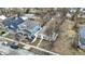 A high-angle view of the property in a residential area, showing its layout relative to other houses and streets at 2402 Adams St, Indianapolis, IN 46218