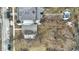 Straight down aerial view revealing the home's roof and surrounding yard with fallen leaves at 2402 Adams St, Indianapolis, IN 46218