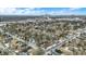 This eye-level neighborhood view includes houses, roads, and trees under a partly cloudy sky, highlighting community living at 2402 Adams St, Indianapolis, IN 46218