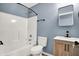 Bathroom featuring white fixtures, a stylish vanity, and a bathtub at 2402 Adams St, Indianapolis, IN 46218