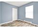 This bedroom features light wood floors, a closet, and a window at 2402 Adams St, Indianapolis, IN 46218