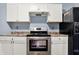 Well-equipped kitchen features stainless steel range and a black refrigerator at 2402 Adams St, Indianapolis, IN 46218