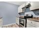 A bright kitchen with clean appliances and neutral countertops at 2402 Adams St, Indianapolis, IN 46218