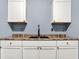 Kitchen with white cabinets, brown countertops, and black fixtures at 2402 Adams St, Indianapolis, IN 46218