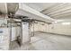 Spacious unfinished basement with exposed piping and concrete floor at 2420 Sheffield Ave, Anderson, IN 46011