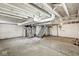 Unfinished basement with exposed pipes, stairs, and concrete floor at 2420 Sheffield Ave, Anderson, IN 46011