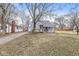Front exterior of single Gathering home with a driveway and mature trees in a grassy yard at 2420 Sheffield Ave, Anderson, IN 46011