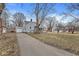 Exterior view of a single Gathering home with a detached garage and driveway at 2420 Sheffield Ave, Anderson, IN 46011