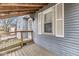 View of the front porch showcasing a ramp, railings, and the home's exterior at 2420 Sheffield Ave, Anderson, IN 46011