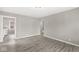 Open-concept living room featuring a large window and neutral paint at 2420 Sheffield Ave, Anderson, IN 46011