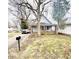 Charming two-story home with a quaint front porch and an expansive front yard at 3209 Bethel Ave, Indianapolis, IN 46203