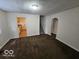 Spacious living room featuring an archway and stairs, perfect for gatherings at 3209 Bethel Ave, Indianapolis, IN 46203
