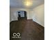 Inviting living room with an archway, ready for entertaining guests or relaxing at 3209 Bethel Ave, Indianapolis, IN 46203
