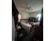 A bedroom with a double bed, closet, and window to let sunlight in at 3451 Brouse Ave, Indianapolis, IN 46218