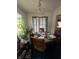 Charming dining room with a chandelier and lots of sunlight at 3451 Brouse Ave, Indianapolis, IN 46218