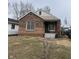 Charming brick home with a cozy front porch and well-maintained landscaping at 3451 Brouse Ave, Indianapolis, IN 46218