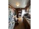 Cozy kitchen with wooden cabinets and a view to the backyard at 3451 Brouse Ave, Indianapolis, IN 46218