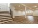 Spacious finished basement with hardwood floors, staircase and recessed lighting, perfect for entertaining at 3588 Marketplace Ct, Zionsville, IN 46077