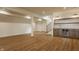 Finished basement with modern vinyl flooring and a wet bar complete with a beverage fridge at 3588 Marketplace Ct, Zionsville, IN 46077