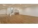 Spacious finished basement with hardwood floors, staircase and a stylish wet bar at 3588 Marketplace Ct, Zionsville, IN 46077