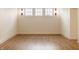 Finished basement space with three windows allowing for natural light, and custom sconces at 3588 Marketplace Ct, Zionsville, IN 46077