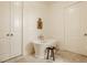 Bright bathroom features a classic standalone tub with elegant fixtures and refined decor at 3588 Marketplace Ct, Zionsville, IN 46077