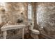 Elegant powder bathroom with designer wallpaper, a decorative mirror, and a modern vanity at 3588 Marketplace Ct, Zionsville, IN 46077