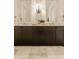 Modern bathroom features a double sink with marble countertop and decorative mirrors at 3588 Marketplace Ct, Zionsville, IN 46077