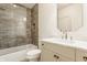 Updated bathroom featuring glass enclosed shower, hexagon tile floor and vanity with marble countertop at 3588 Marketplace Ct, Zionsville, IN 46077