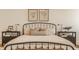 A well-lit bedroom showcasing decorative lighting, neutral décor, and framed wall art at 3588 Marketplace Ct, Zionsville, IN 46077