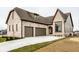 Beautiful brick home featuring an attached two car garage, arched front door, and newly seeded lawn at 3588 Marketplace Ct, Zionsville, IN 46077