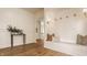 Stylish foyer featuring hardwood floors, an arched doorway, and a cozy built-in bench, perfect for entry at 3588 Marketplace Ct, Zionsville, IN 46077