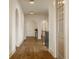 This hallway has high ceilings, hardwood floors, arched doorways, and natural light from the windows at 3588 Marketplace Ct, Zionsville, IN 46077