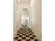 Hallway with arched entryway, checkerboard tile and a view of the staircase at 3588 Marketplace Ct, Zionsville, IN 46077