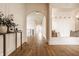 Beautiful hallway with hardwood floors, arched doorways, and custom trim, creating an inviting atmosphere at 3588 Marketplace Ct, Zionsville, IN 46077