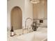Kitchen island with white marble countertop, chrome faucet, and decorative accessories at 3588 Marketplace Ct, Zionsville, IN 46077