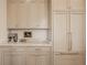 Custom kitchen cabinets with gold hardware, marble countertops, and stainless steel appliances at 3588 Marketplace Ct, Zionsville, IN 46077