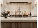 Close-up of a kitchen island featuring a marble countertop, stainless steel faucet, and stylish decor, ideal for cooking at 3588 Marketplace Ct, Zionsville, IN 46077