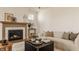 A beautifully decorated living room featuring a fireplace, comfortable seating, and stylish decor at 3588 Marketplace Ct, Zionsville, IN 46077