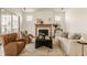 A beautifully decorated living room with a fireplace, comfortable seating, and sliding doors at 3588 Marketplace Ct, Zionsville, IN 46077