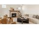 A beautifully decorated living room featuring a fireplace, comfortable seating, and plenty of natural light at 3588 Marketplace Ct, Zionsville, IN 46077