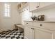 Bright mudroom with bench, hooks, and custom cabinetry for storage at 3588 Marketplace Ct, Zionsville, IN 46077