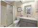 Bathroom featuring a walk-in shower, granite countertop vanity, and neutral color scheme at 3636 Woodglen Way, Anderson, IN 46011