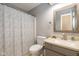 Cozy bathroom featuring a shower-tub combo and a vanity with a mirror at 3636 Woodglen Way, Anderson, IN 46011