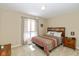 Bright bedroom featuring a large window and warm neutral color walls at 3636 Woodglen Way, Anderson, IN 46011