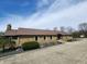 Charming ranch-style home with stone facade, mature landscaping, and a welcoming entrance at 3636 Woodglen Way, Anderson, IN 46011