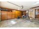 Garage featuring a workbench, storage cabinets, and an epoxy-coated floor at 3636 Woodglen Way, Anderson, IN 46011