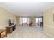 Spacious living room with plush carpeting, a large window, and comfortable furnishings at 3636 Woodglen Way, Anderson, IN 46011